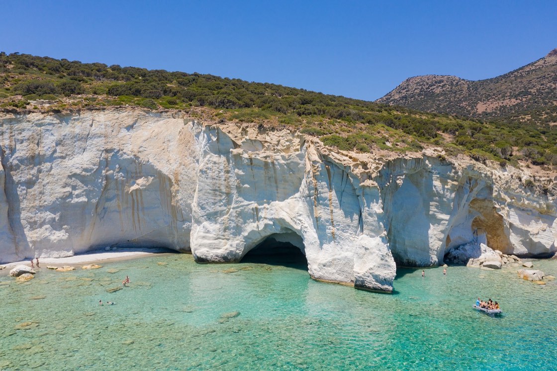The white sea caves of Kleftiko rising from turquoise water on Milos